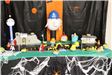 Cityscape with small pumpkins as Minions from Despicable Me. Large pumpkin is decorated as Gru.