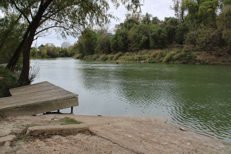The Guadalupe River flows past the boat ramp