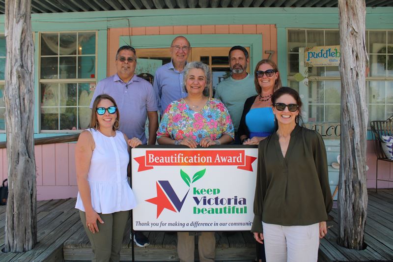 Group photo with KVB sign at Puddleback Gifts and More