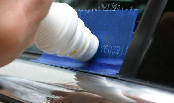 A VIN Number being etched onto a vehicle's window