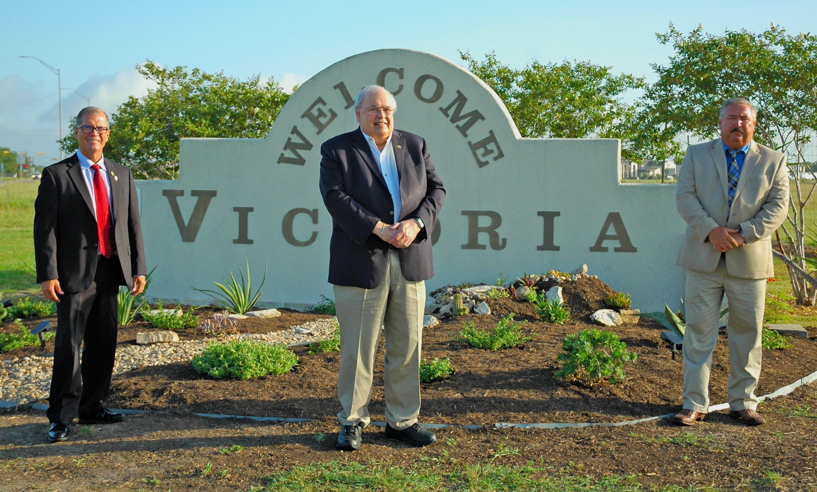 Councilman, mayor and Environmental Services director in front of 