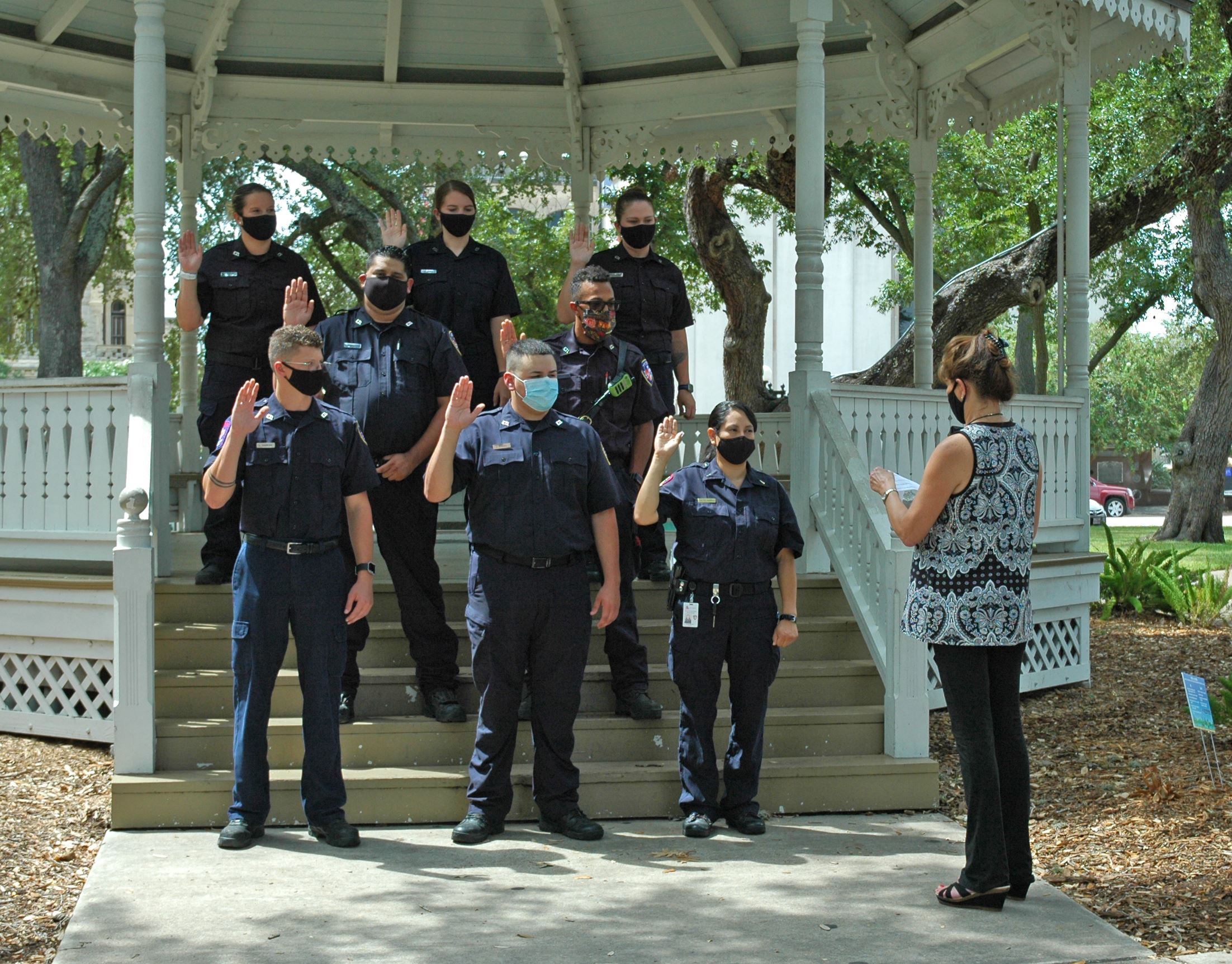 Eight fire department recruits are sworn in at the DeLeon Plaza gazebo