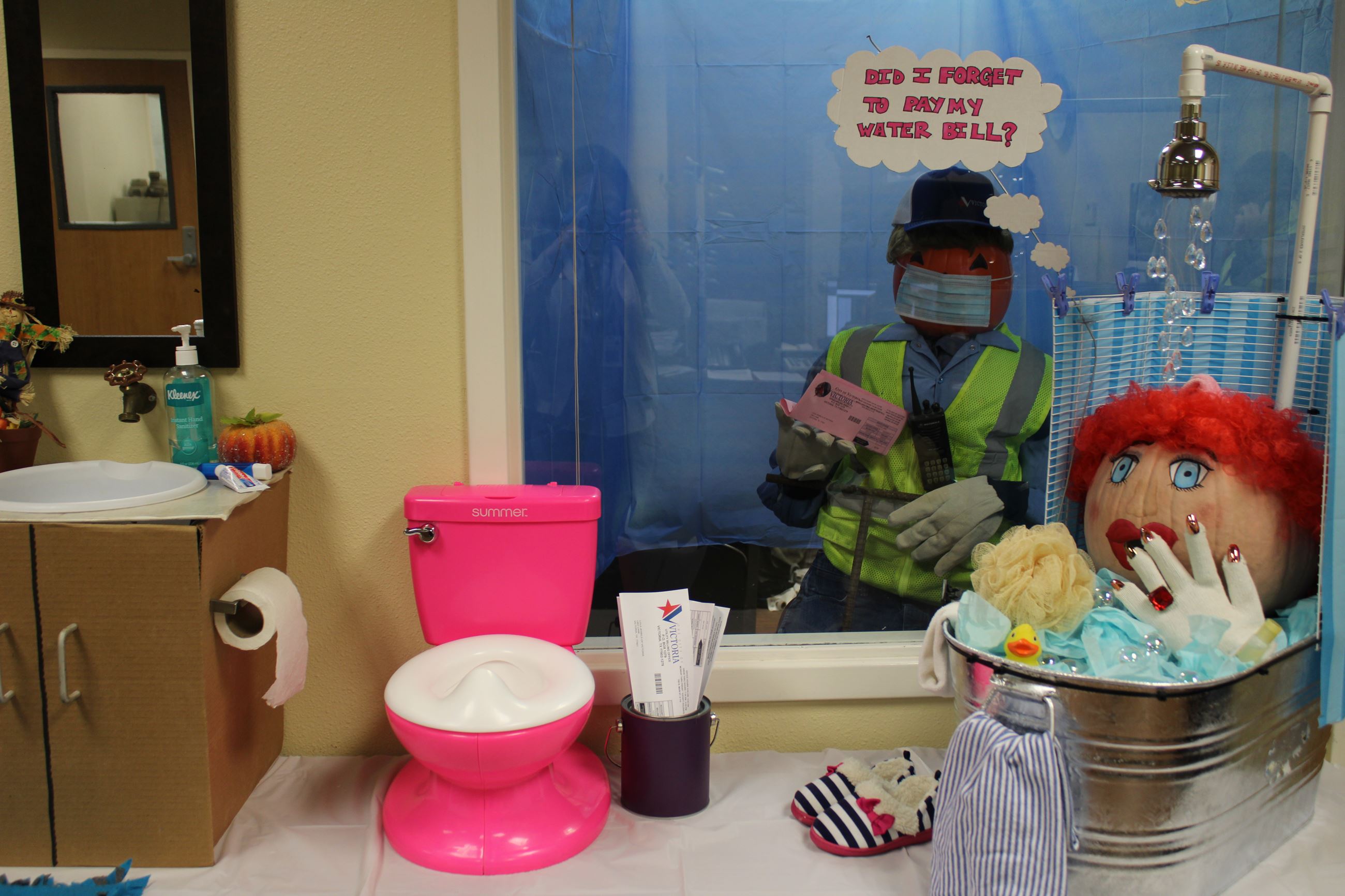 Pumpkin woman in shower. Pumpkin man outside. Thought bubble: Did I forget to pay my water bill?