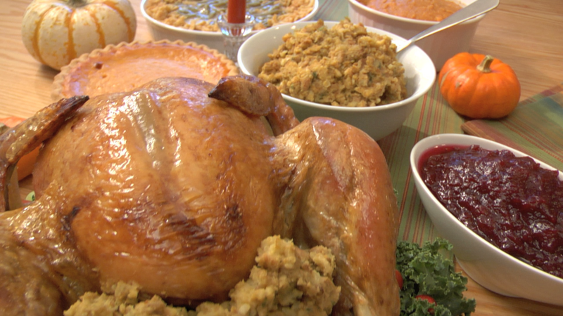 Thanksgiving meal with turkey, stuffing and traditional sides.