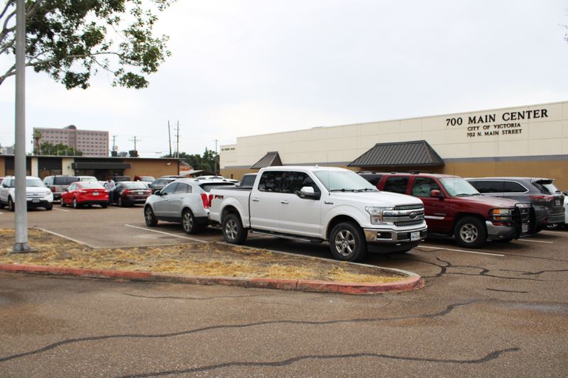 Parking lot near Utility Billing Office. Traffic islands with dead grass.