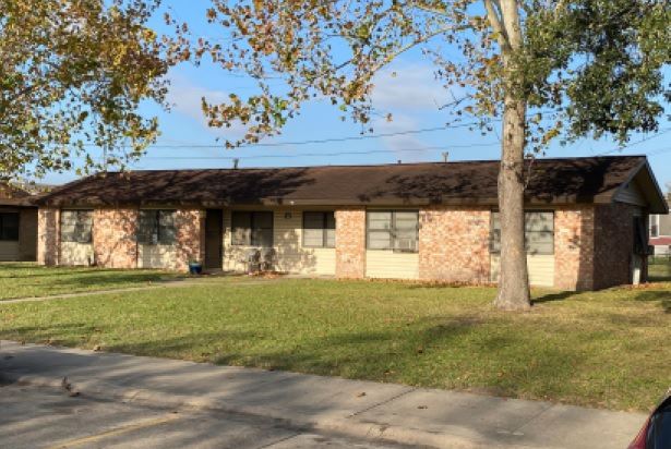 A small brick multifamily housing structure