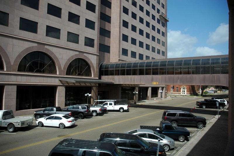 Tall building with covered pedestrian walking bridge