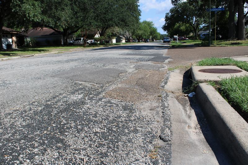 A road with uneven patches.