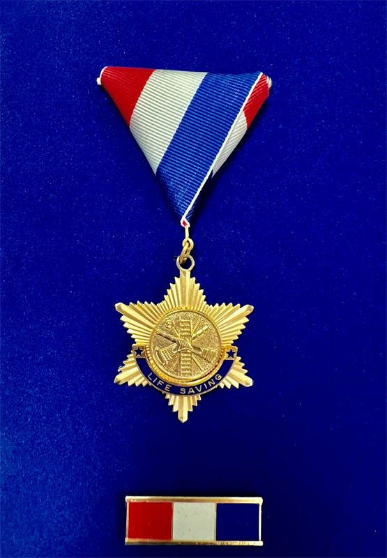 A medal. Text reads "Life Saving."