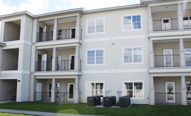 An outside view of Enchanted Gardens Apartments